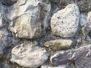 Close-up of mixed textured stones in natural arrangement