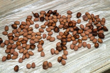 Washed cherry pits drying on a table after cleaning, ready for reuse or crafting purposes