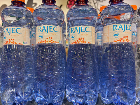 Bratislava, Slovakia, Europe - Jul 03, 2025: multiple plastic bottles of rajec kyslik oxygen natural mineral water, with blue labels featuring an animal illustration and orange speckled pattern