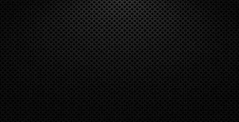 Black perforated metal texture background with round holes and light gradient
