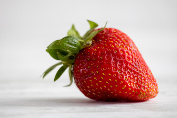 Fresh organic strawberries on a light background