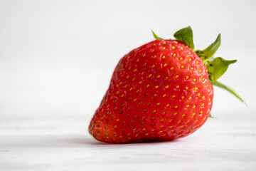 Fresh organic strawberries on a light background