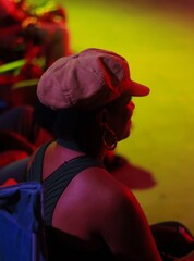 Editorial, non-staged photo dated June 21, 2025 of the back of a woman's head. She is wearing a cap...
