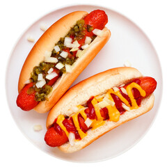 Two grilled hot dogs on a white plate. Toppings of relish and onions; and mustard, ketchup and...