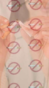 Animation of rows of lit cigarettes with no smoking signs over woman breaking cigarette