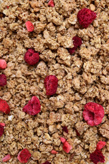 granola with freeze-dried raspberries food background