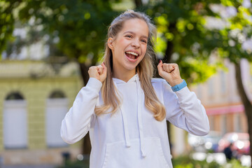Oh my God, wow. Caucasian young woman looking surprised, shocked by sudden victory, game winning,...