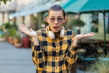 I don't know what to say. Confused young man feeling embarrassed about ambiguous question, having...