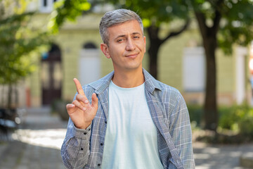 Displeased upset middle-aged man reacting to unpleasant awful idea, dissatisfied with bad quality,...