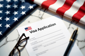 US Visa Application form on a marble desk, with an American flag. A symbol of immigration, legal process, global mobility, and new opportunities.