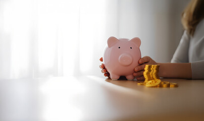 A young girl gently holds a piggy bank with both hands,A piggy bank symbolizes more than just saving coins—it represents discipline, dreams, and a hopeful future.