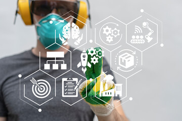 Worker using virtual touch screen presses icon symbolizing industrial innovation: rocket with...
