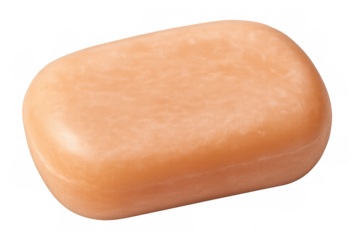 Orange soap bar sitting on clear surface, highlighting personal care and cleansing essentials