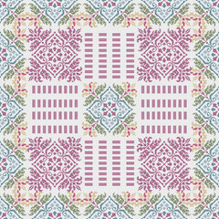 Decorative textiles in a soft pastel palette of pink, blue, and green with pixelated element