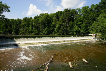 Waterfall dam flowing into the Sheboygan River at Settlers Park in Sheboygan Falls, Wisconsin. 