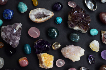 Background of beautiful natural colored semi-precious stones. Purple fluorite, rose quartz and...