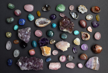 Background of beautiful natural colored semi-precious stones. Purple fluorite, rose quartz and...