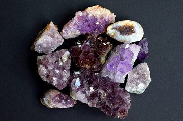 Beautiful natural colored semi-precious stones. Close-up of amethyst druse on dark background....