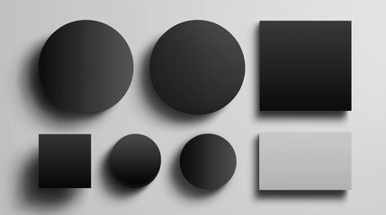 Black and white circles and squares casting shadows on a gray background