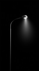 Street lamp illuminating dark urban night with bright light