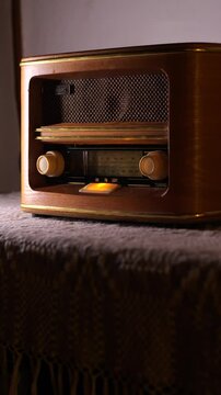 vertical video Vintage radio receiver displaying fm frequency and tuning knob
