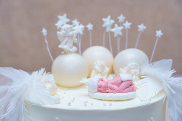 Intricate cake with decorative figures and stars for a special celebration