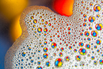 abstract colored balls of oily liquid on a blurred background