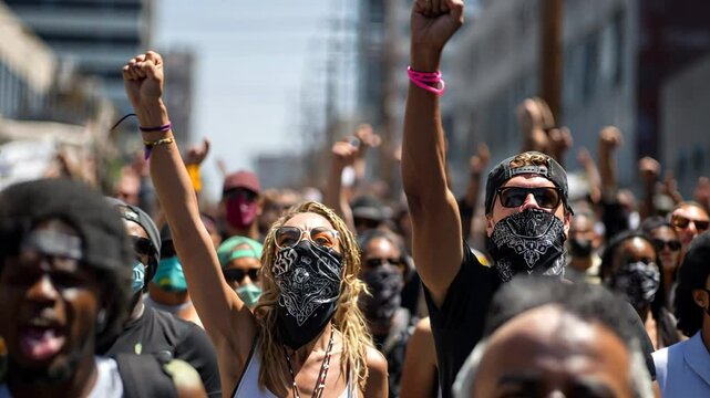 Crowd of protesters protesting on a city street