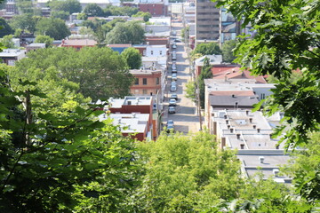 Fototapeta premium Aerial view of a residential area and a street with cars. Cityacape with houses and street. A view of the lower town in Quebec city. 