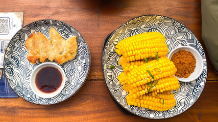 Spicy Corn Ribs Vegan Vegetarian Plant Based Trendy Food Concept and gyoza