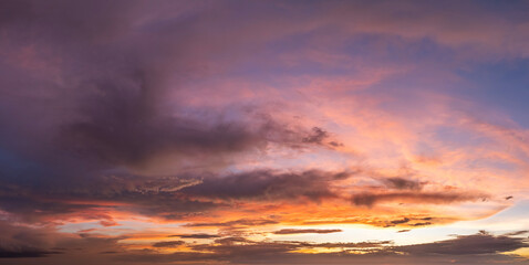Evening sunset sky with colorful clouds. Panoramic skyscape