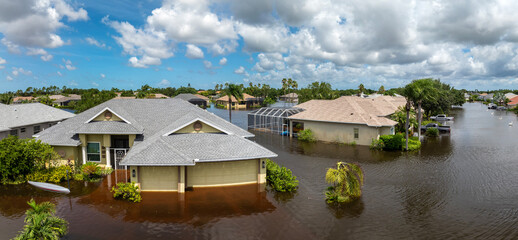 Flooded residential area with underwater houses from hurricane rainfall water in Florida suburban...