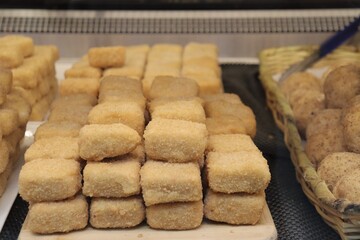 Homemade parmesan fondue in sqare shape. Food and recipe with cheese. Frying recipe. Appetizing...