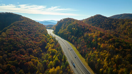 I-40 freeway road leading to Asheville in North Carolina thru Appalachian mountains with yellow...