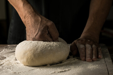 Elderly Hands Kneading Dough for Homemade Bread