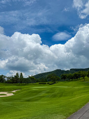 Scenic View of a Golf Course under a Dramatic Cloudy Sky