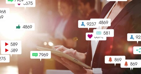 Mid adult woman tapping tablet creating social media notifications flooding business meeting team - Powered by Adobe