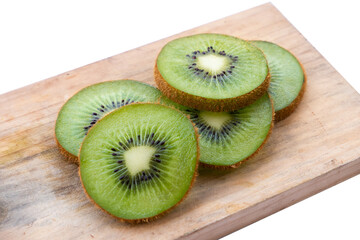 close-up of sliced kiwi fruit on wooden cutting board