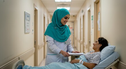 Compassionate healthcare professional in a hijab gently interacts with a patient in a hospital hallway, offering comfort and care.