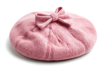 Soft pink knitted beret with a bow, isolated on a white background, suitable for fashion photography
