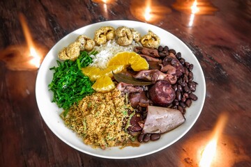 The best traditional Brazilian feijoada completely served in the most authentic style accompanied by the irresistible and iconic cachaça caipirinha