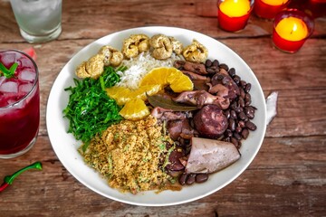 The best traditional Brazilian feijoada completely served in the most authentic style accompanied by the irresistible and iconic cachaça caipirinha