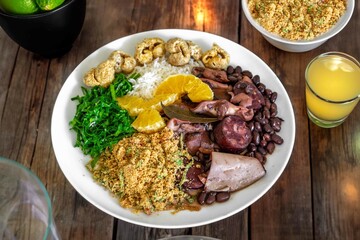 The best traditional Brazilian feijoada completely served in the most authentic style accompanied by the irresistible and iconic cachaça caipirinha