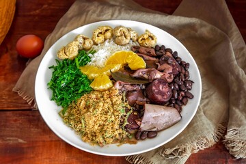 The best traditional Brazilian feijoada completely served in the most authentic style accompanied by the irresistible and iconic cachaça caipirinha
