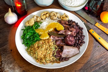 The best traditional Brazilian feijoada completely served in the most authentic style accompanied by the irresistible and iconic cachaça caipirinha