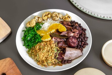 The best traditional Brazilian feijoada completely served in the most authentic style accompanied by the irresistible and iconic cachaça caipirinha