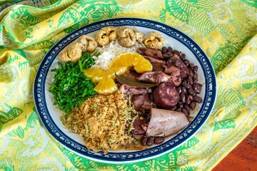 The best traditional Brazilian feijoada completely served in the most authentic style accompanied by the irresistible and iconic cachaça caipirinha