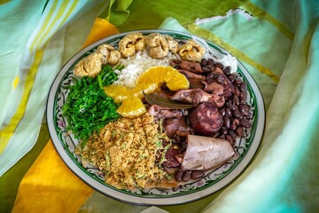 The best traditional Brazilian feijoada completely served in the most authentic style accompanied by the irresistible and iconic cachaça caipirinha