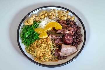 The best traditional Brazilian feijoada completely served in the most authentic style accompanied by the irresistible and iconic cachaça caipirinha