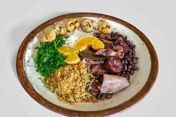 The best traditional Brazilian feijoada completely served in the most authentic style accompanied by the irresistible and iconic cachaça caipirinha